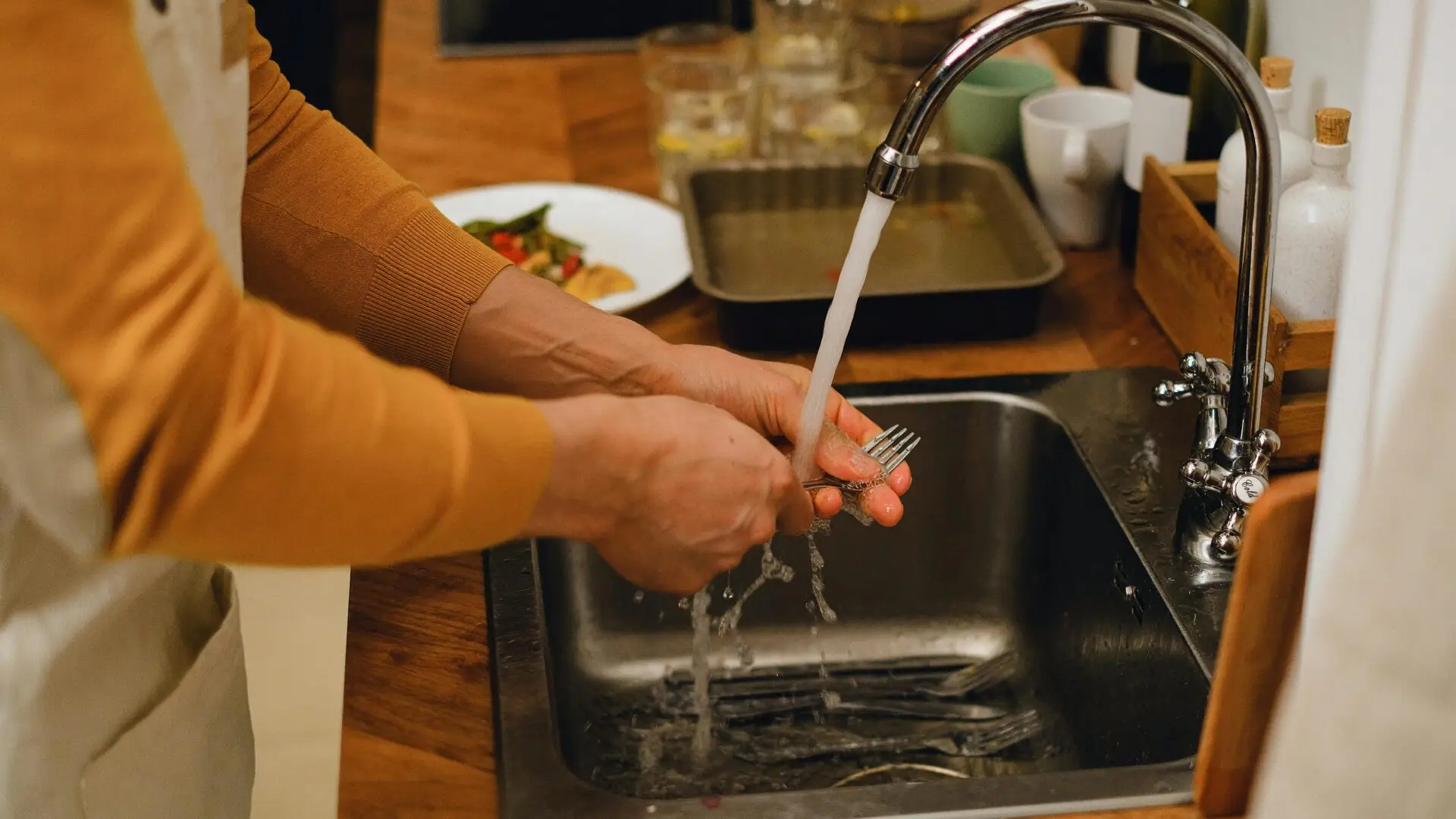 Garbage disposal installation under kitchen sink with electrical connections